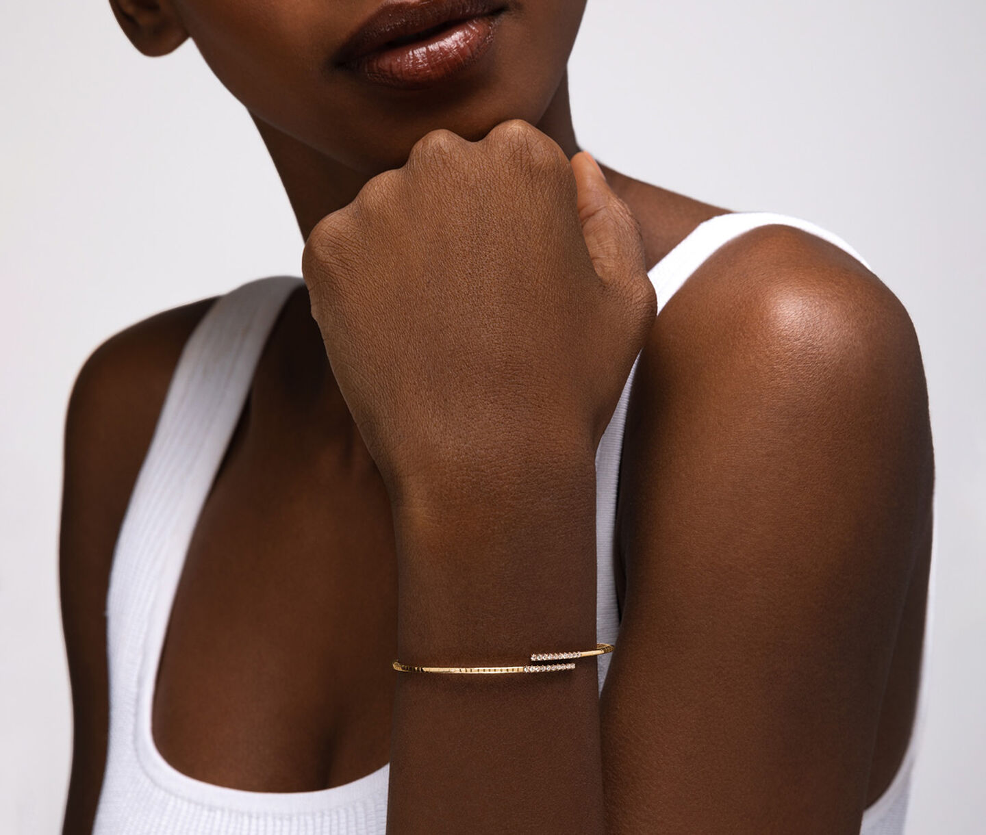 A woman wearing a Birks Rosee du Matin diamond bracelet.